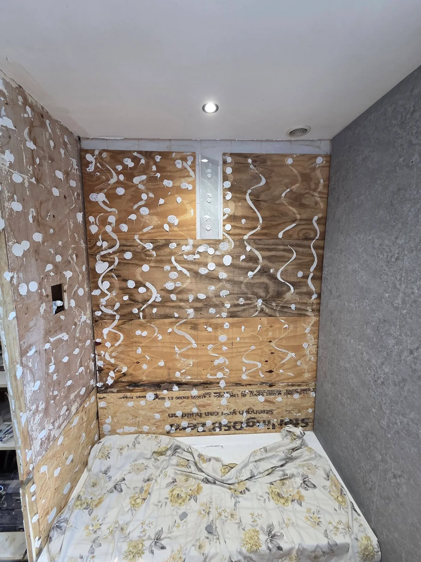 Exposed wall surfaces in the shower enclosure during the refit.
