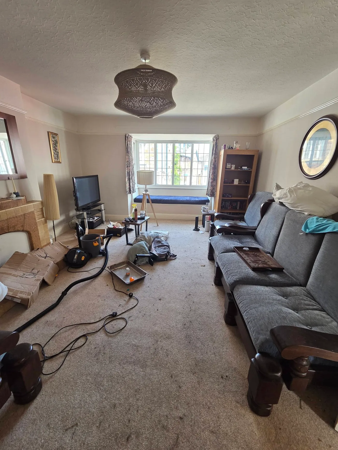 The living room during the renovation, with tools and materials in place.