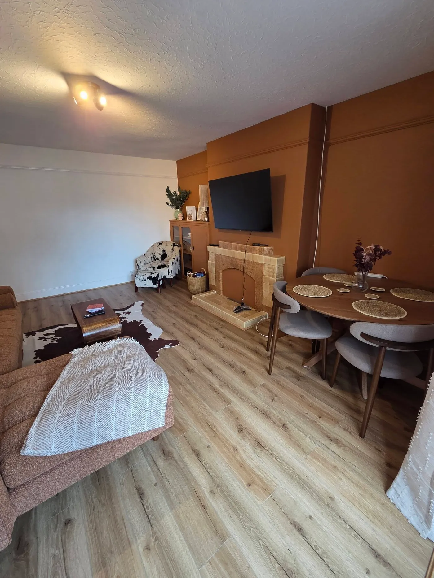 The completed living room viewed towards the fireplace and bay window.