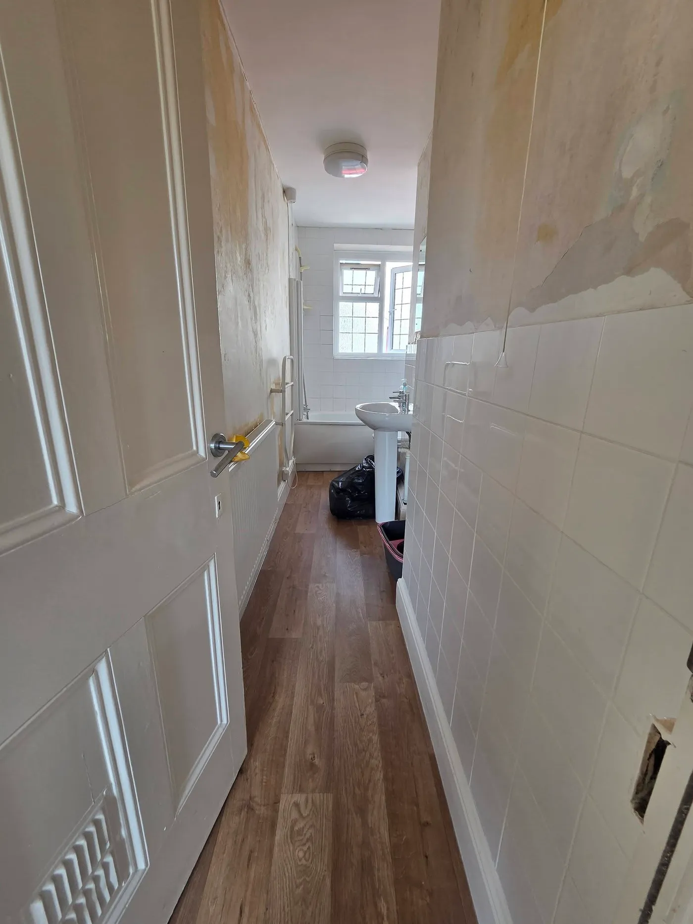 The bathroom approach during wall preparation.