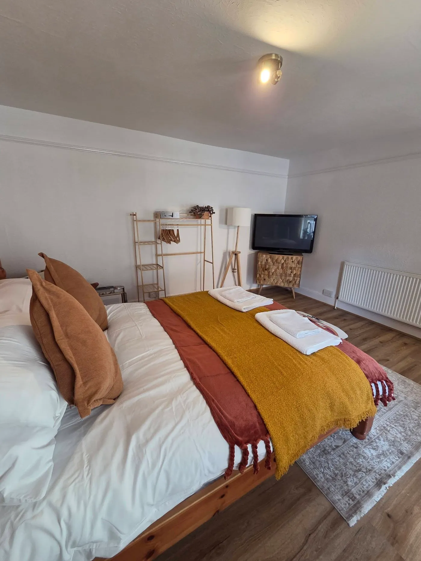 A second view of the decorated bedroom and its furnishings.